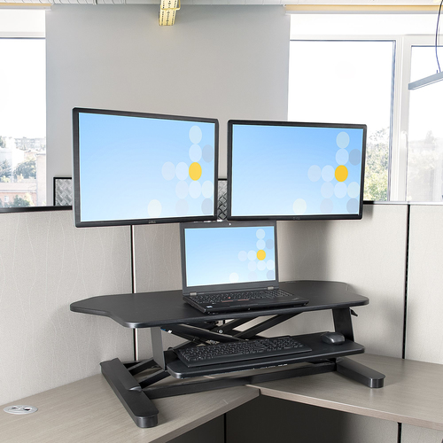 StarTech.com Corner Sit Stand Desk Converter with Keyboard Tray - Large Surface (35" x 21") - Height Adjustable Ergonomic Desktop/Tabletop Standing Workstation - Supports Dual Monitors